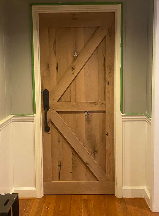 Barn style door made by carpenter from white oak